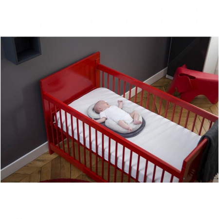 Soporte anatómico para dormir cosydream de Babymoov. Puede usarse en cualquier cuna.
