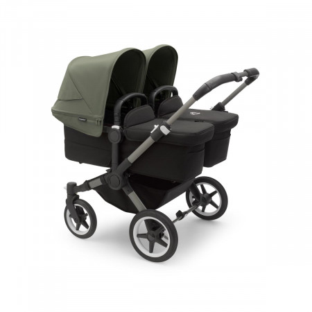 Cochecito Bugaboo donkey 5 twin, con chasis grafito, funda negra y capota en verde bosque.