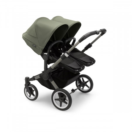 Silla de paseo Bugaboo donkey 5 twin, con chasis grafito, funda negra y capota en verde bosque.