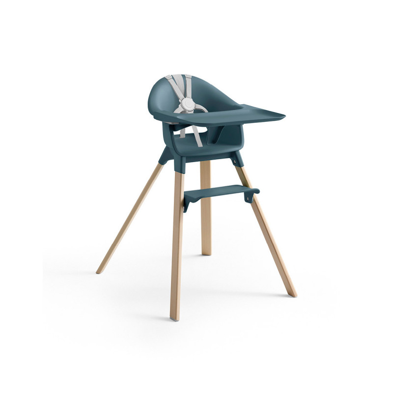 Trona Clikk de Stokke en color azul y patas de madera de haya. Incluye bandeja y arnés.